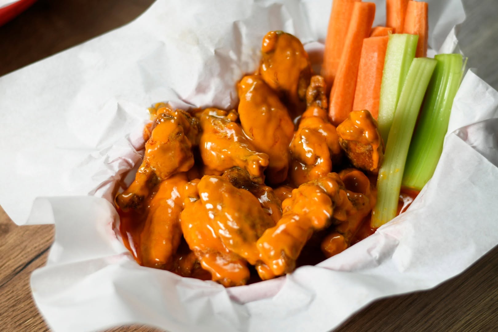 Crispy BBQ wings on dark slate
